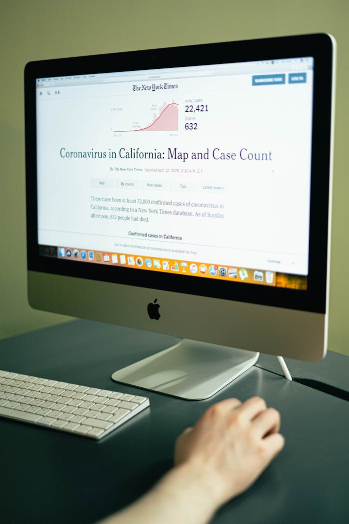 who-we-are A computer displaying coronavirus case numbers in California on a news website.